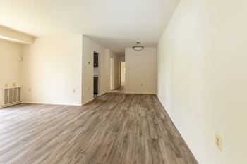 Bedroom with hardwood floors and white walls
